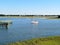 A sailboat on the marsh and wetlands along Shem Creek in Charleston, South Carolina