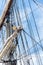 Sailboat masts, rigging and rolled up sails