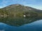 A sailboat in the middle of a huge lake