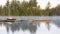 Sailboat moored at dock in early morning on calm quiet lake