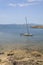 Sailboat moored in shallow water Cala Estancia