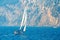 Sailboat navigates in the inshore waters of 5 Terre