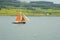 Sailboat with Orange Sails on the Sound of Mull, Scotland, UK.