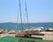 Sailboat parked on the edge of the beach, about to be pushed in to the sea at town of Pakostane