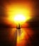 Sailboat on peaceful sea under the sunrise