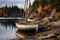 A sailboat peacefully rests in calm waters, its sails tattered and hull weathered by the passage of time