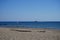 Sailboat and pedal catamaran or pedal boat in the Mediterranean off the coast of the island of Rhodes. Kolympia, Greece