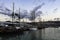 Sailboat on the pier in the port.Several moored vintage marine sailing ships in the seaport.