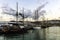 Sailboat on the pier in the port.Several moored vintage marine sailing ships in the seaport.