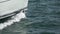 Sailboat prow sailing closeup in super slow motion