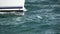 Sailboat prow sailing closeup in super slow motion