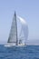 Sailboat Racing In The Blue Ocean Against Sky