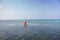 Sailboat with red sail on the sea. Reggata concept. Marine race. Yacht with red sail on tropical seascape. Summer recreation.