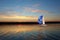 Sailboat sail off into the sunset on Lake.Journey on a sailing boat.Summer travel
