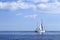 Sailboat sailing on blue sea horizon ocean