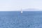 Sailboat sailing next to the Aguilas lighthouse in Spain