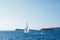 Sailboat sails past the coast of Mamula Island