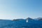 Sailboat sails past the coast of Montenegro to the Mamula island