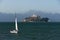 A sailboat in San Francisco Bay with Alcatraz Island in the distance