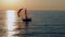 Sailboat in the sea in the evening sunlight, luxury summer adventure, active vacation