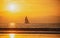 Sailboat at sea. Seascape golden sunrise over the sea. Yacht sailing in the sunrise time. Sea landscape view with a