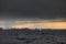 Sailboat in sea at stormy weather, stormy clouds sky orange sky, sail regatta, reflection of sail in the water, bigl