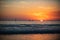 Sailboat at sea. Sunrise over the sea and beautiful cloudscape. Colorful ocean beach sunset.