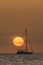 A sailboat silhouette at sunset