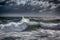 sailboat slicing through choppy waves on a stormy day