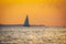 Sailboat at sunset in the bay