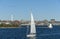 Sailboat under sail on Acushnet River