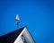 Sailboat weather vane on a roof