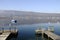 Sailboat and wooden pontoons on annecy lake