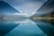 Sailboats on Achensee lake near Innsbruck at peaceful dawn, Tyrol alps, Austria