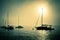 Sailboats along foggy California coast