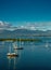 Sailboats in a calm water with mountain and clouds on background at the Guadalupe