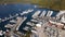 Sailboats With Deflated Sails At Dockside In Sea Bay