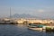 Sailboats in dock against Vesuvius volcano and Mediterranean sea. Boats in harbour in Naples Napoli, Italy.