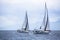 Sailboats in front of the regatta in the morning mist.