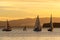 Sailboats on Harbor With Background of Sunset Clouds
