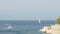 A sailboats on the horizon in the beautiful Mediterranean Sea