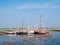 Sailboats in marina at low tide, West Frisian island Schiermonnikoog, Netherlands