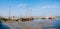 Sailboats in marina at low tide, West Frisian island Schiermonnikoog, Netherlands