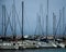 Sailboats in a marina with a storm rolling in on Lake Michigan