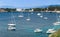 Sailboats, motor boats, and people in billionaire`s bay in Cap d`Antibes on the French riviera