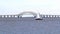 Sailboats moving in front of the Great South Bay Bridge in West Islip New York