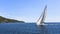 Sailboats participate in sailing regatta.