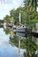 Sailboats with a reflections in a canal in Florida