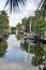 Sailboats with a reflections in a canal in Florida