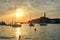 Sailboats at the Rovinj seaside and cityscape at Sunset.